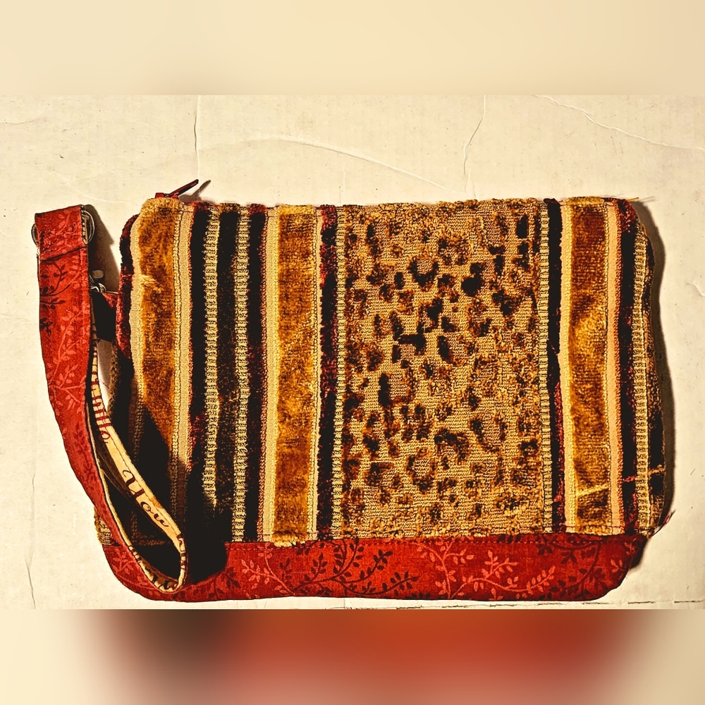 Textured warm Color tiger print and velvet striped wristlet with wine interior